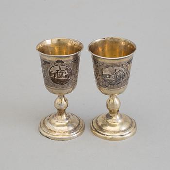 A pair of Russian 19th century parcel-gilt niello footed vodka cups, makers mark cyrillic "МД" (MD).