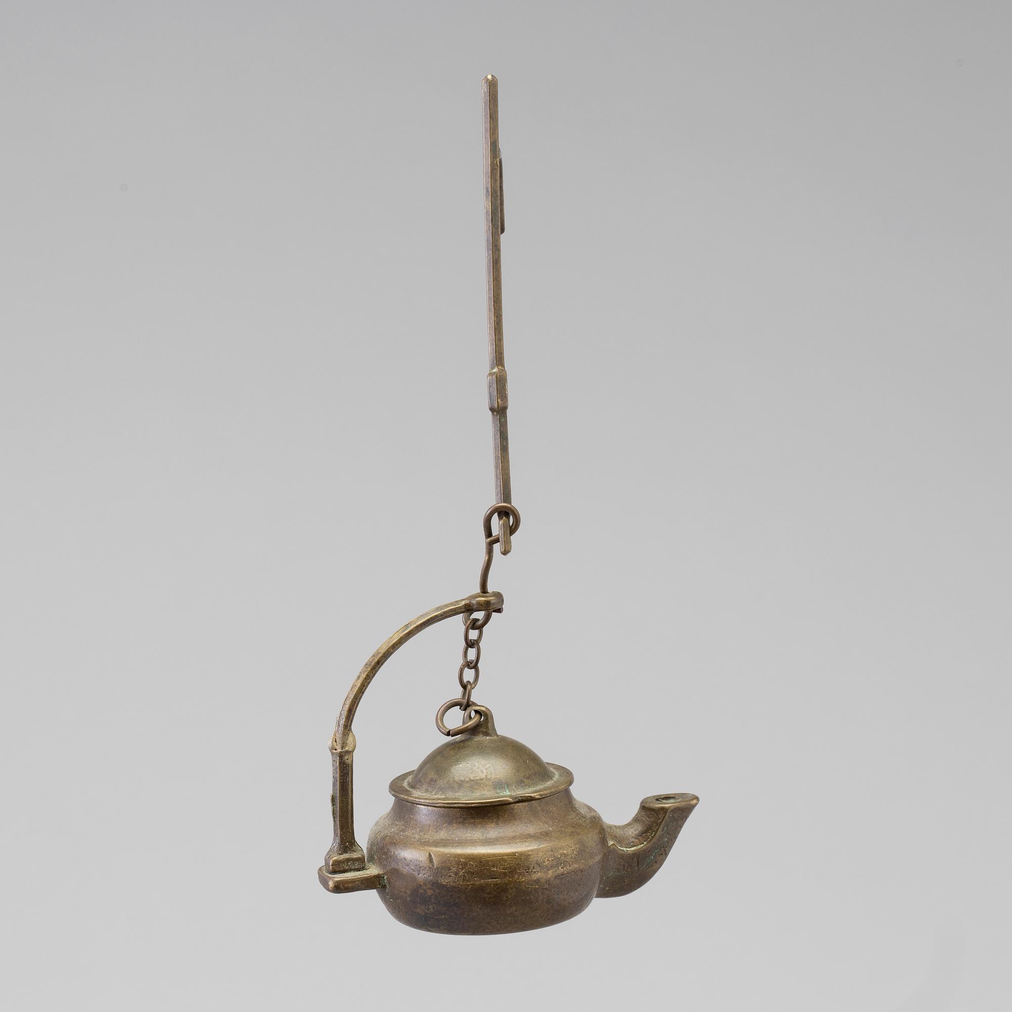 A 18th century oil lamp.