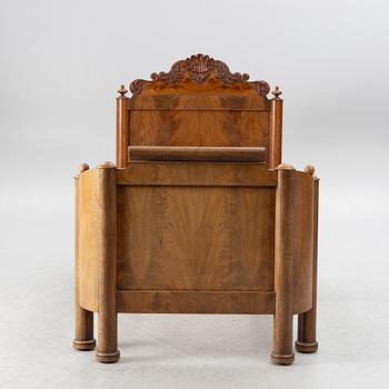 A late Empire bed, mid-19th century.