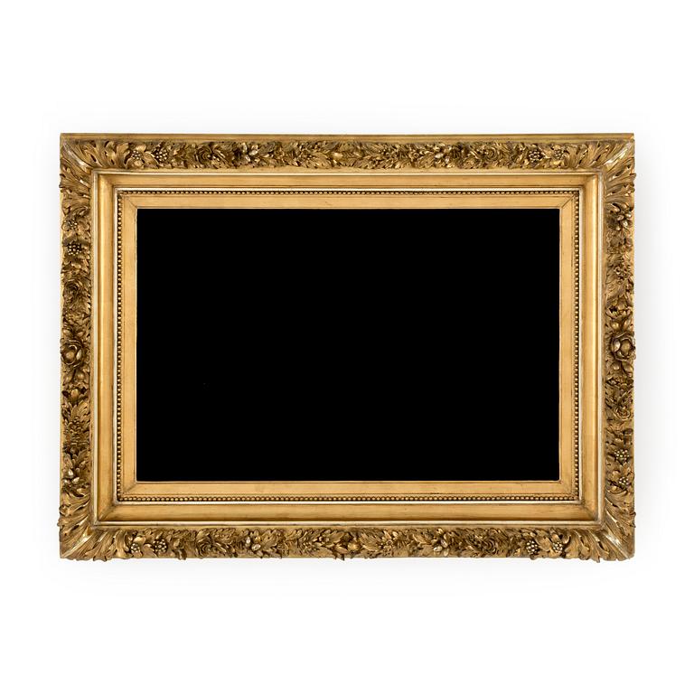 A wood frame with decorations of oak leaves. Circa 1900.