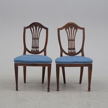 A 19th century dining table and a set of twelve chairs.