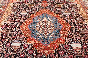 A Kashmar carpet, a. 390 x 305 cm.