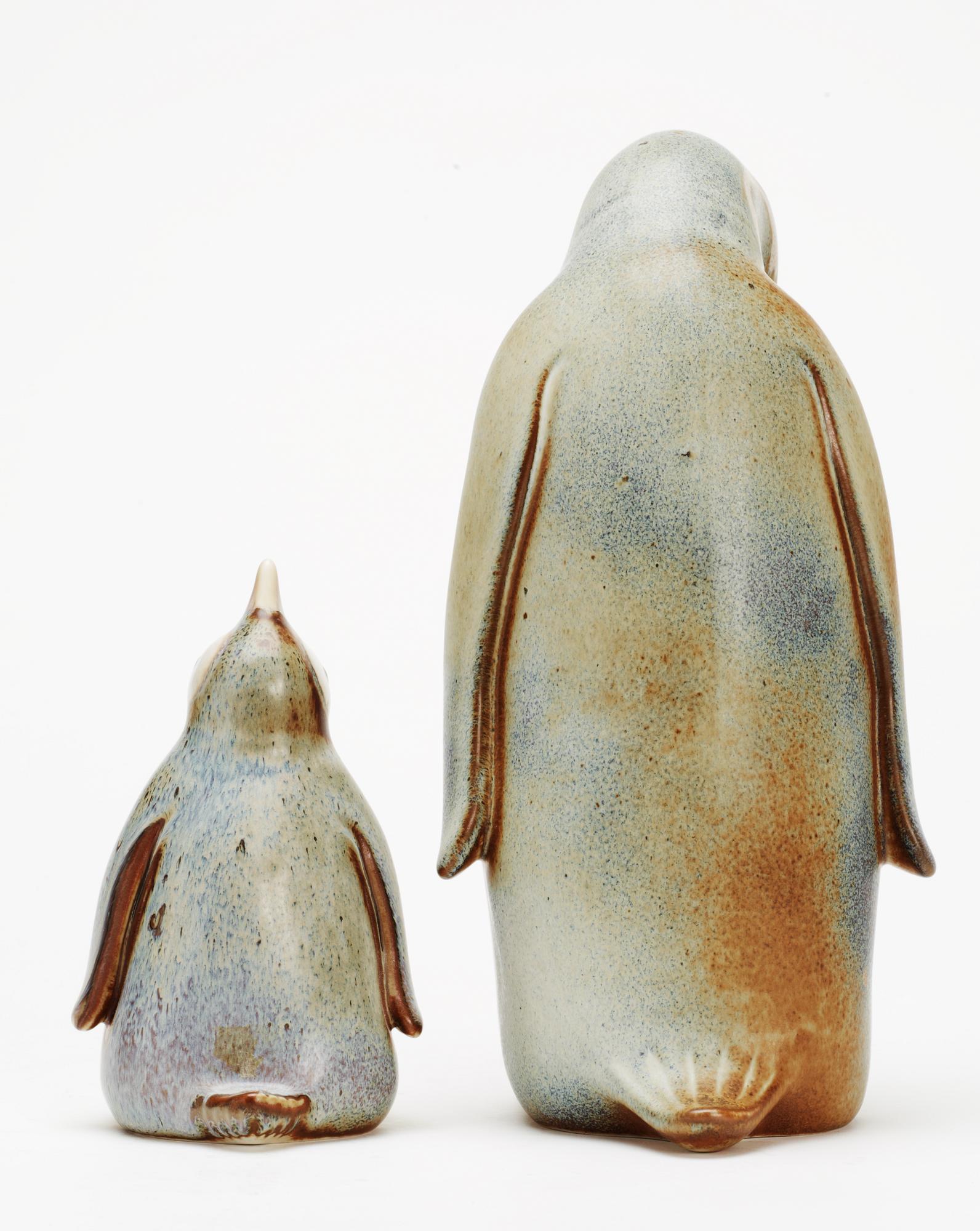 Two Gunnar Nylund stoneware figures depicting a penguin mother and child, Rörstrand.