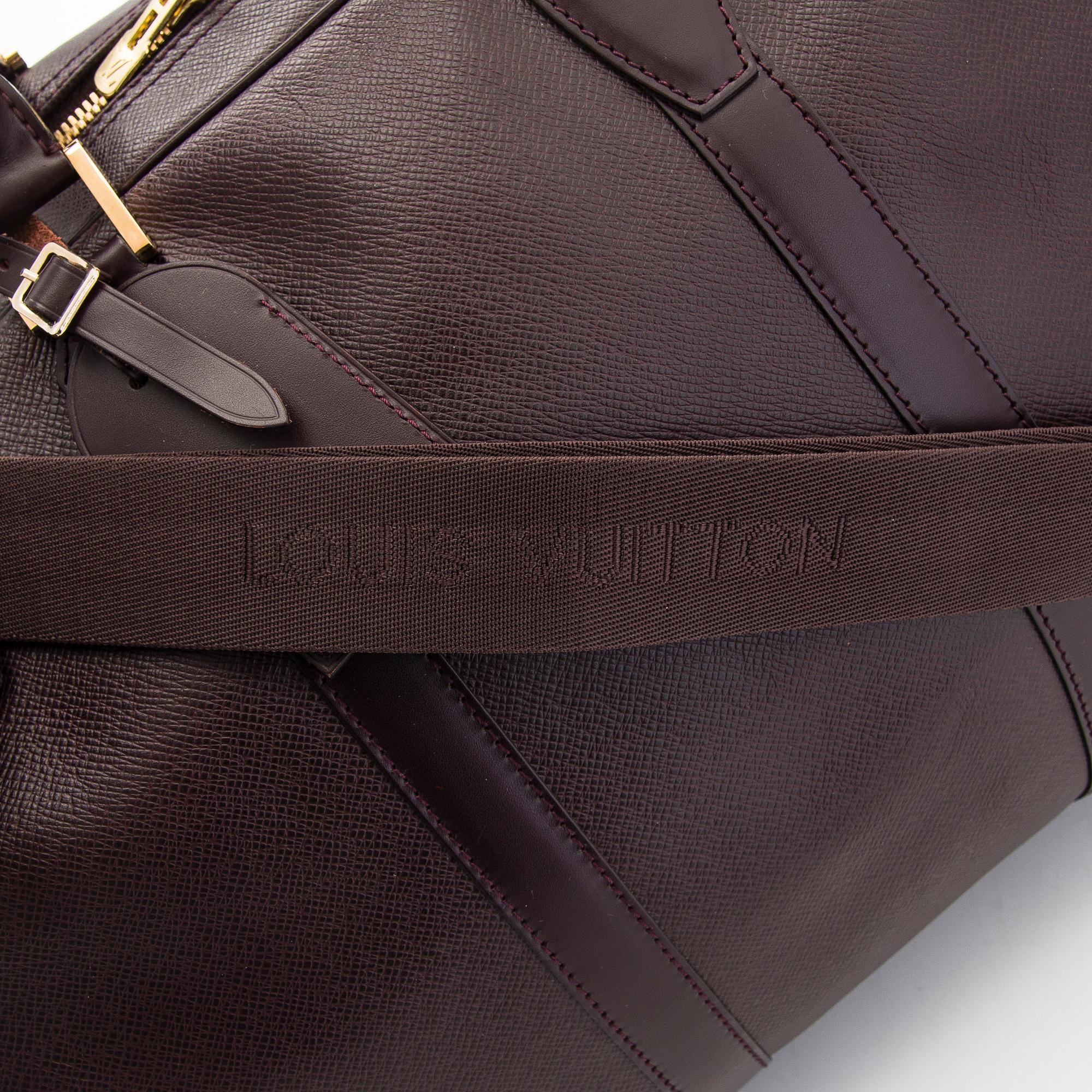 Louis Vuitton, a 'Taiga Kendall PM' weekend bag.