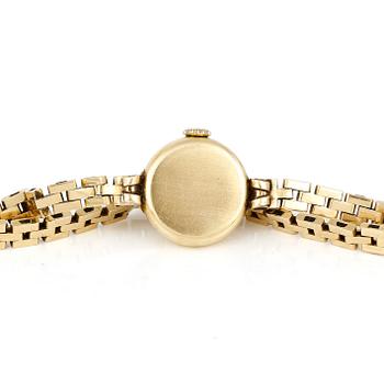 ARMBANDSUR, dam, 18K guld, 'Cyma, CymaFlex' Le Locle, Schweiz 1900-talets mitt. Total vikt ca 18,97 g.