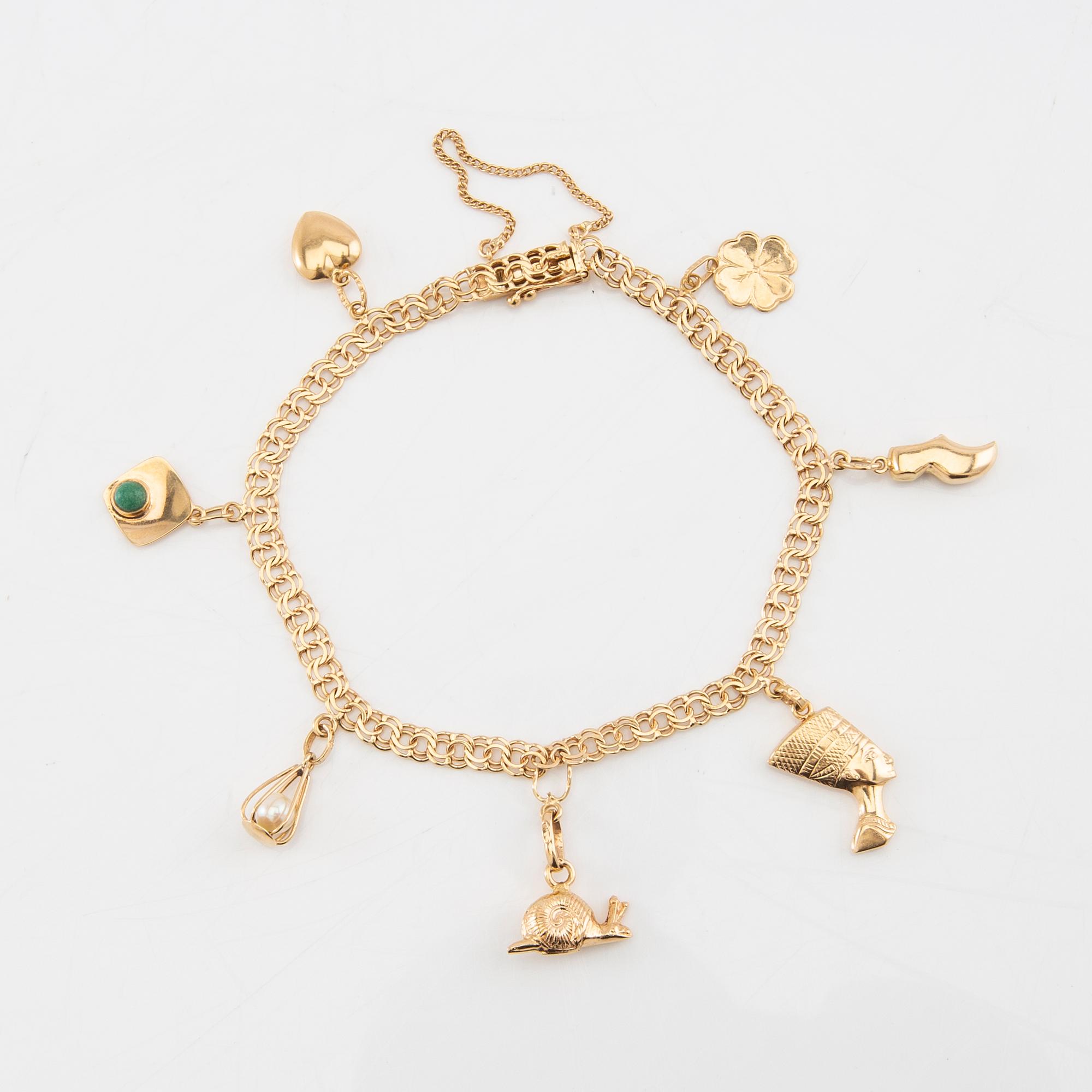Armband Bismarck-länk 18K guld med berlocker.