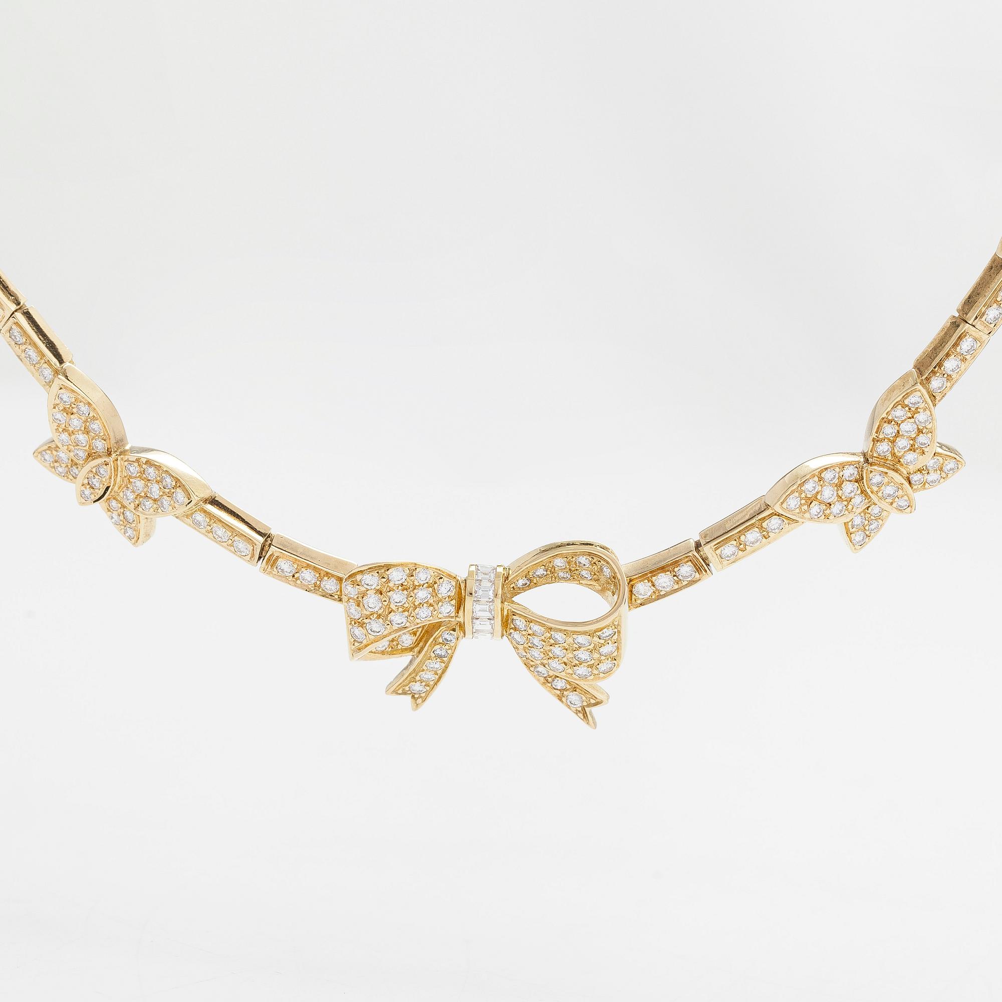 An 18K gold necklace, with brilliant- and baguette-cut diamonds totaling approx. 4.44 ct.