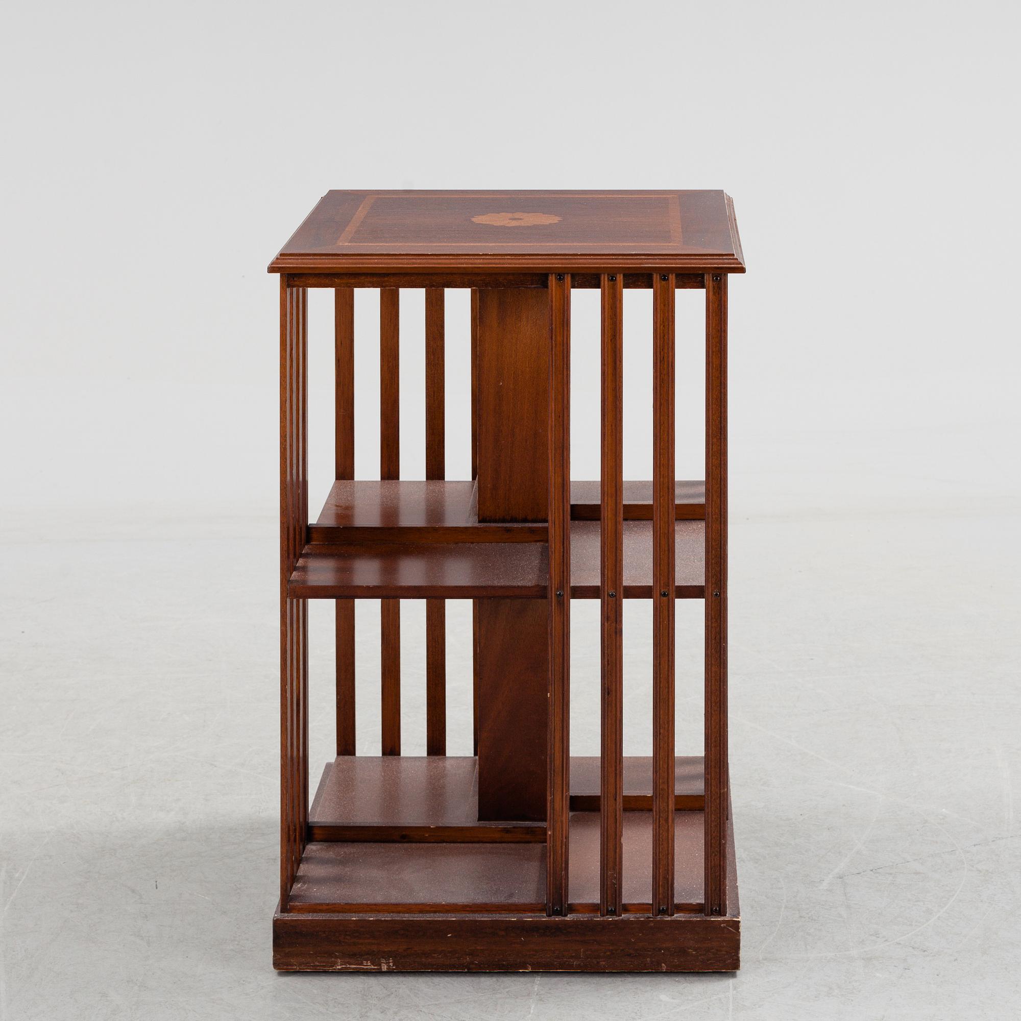 A mahogany veneered revolving bookcase, late 20th Century.