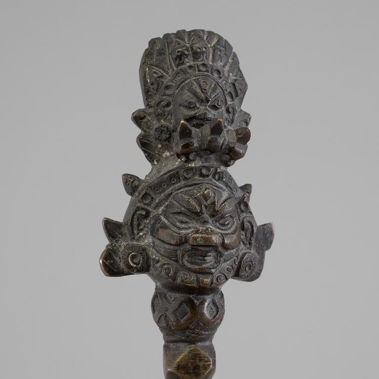 An early 20th century Tibetian bronze Phurba (ritual dagger) and censor.