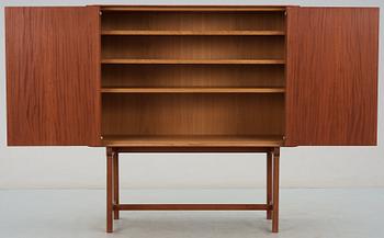 A Josef Frank mahogany cabinet, doors and sides covered in Frank's floral chintz fabric 'Fatima', Svenskt Tenn ca 1937.