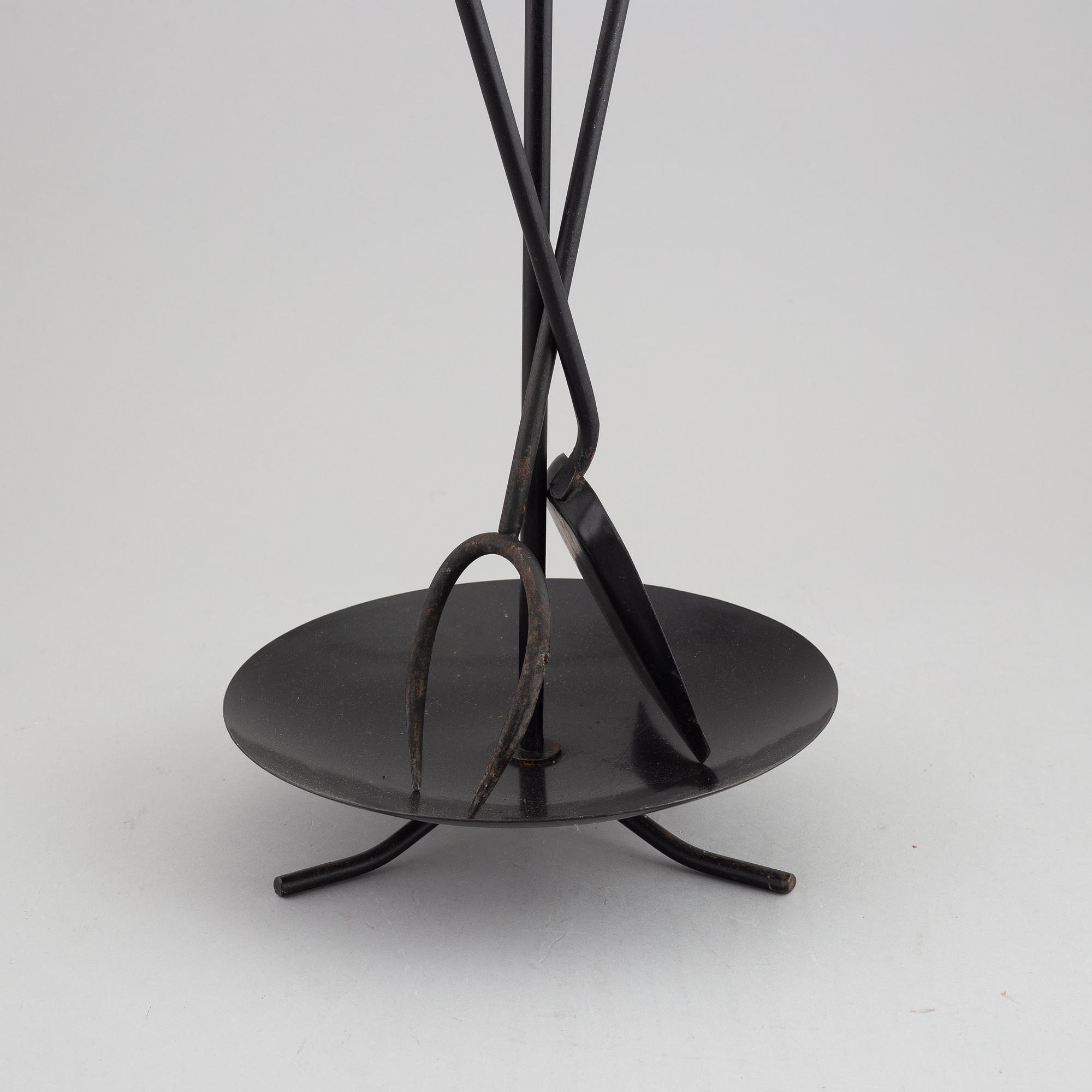 A fireplace stand of three parts by Gunnar Ander for Ystad Metall.