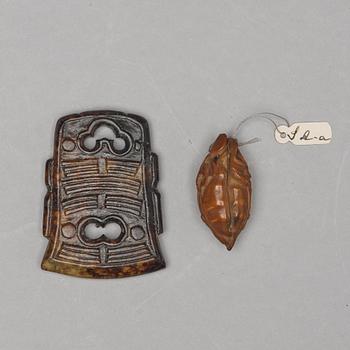 A sculptured nut and a cultpured nephrite object, Qing dynasty (1664-1912).