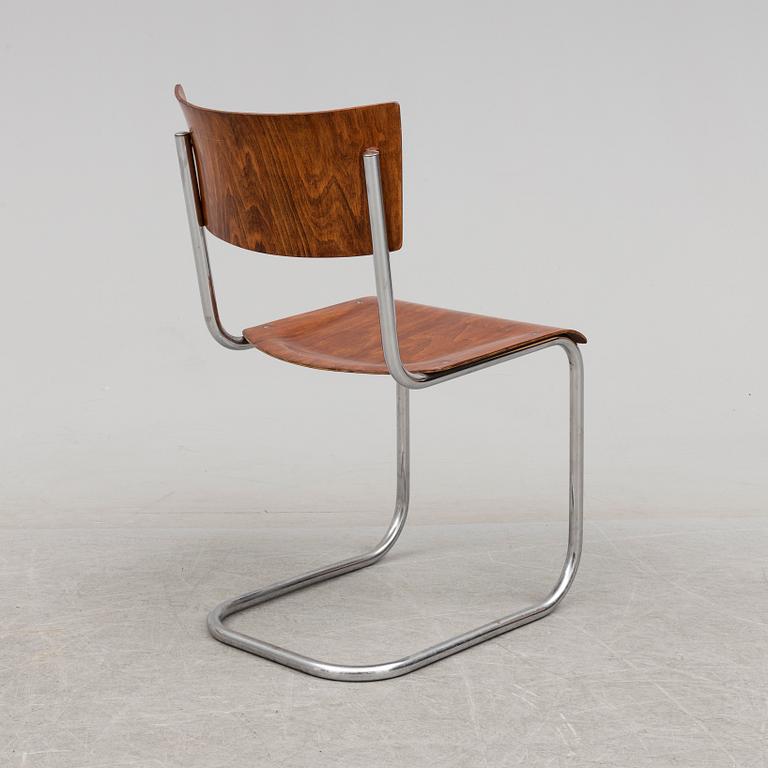 A 1930s writing desk by Jindrich Halabala and chair by Mart Stam.