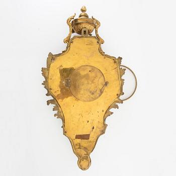 Wall clock in Louis XV style, circa 1900.