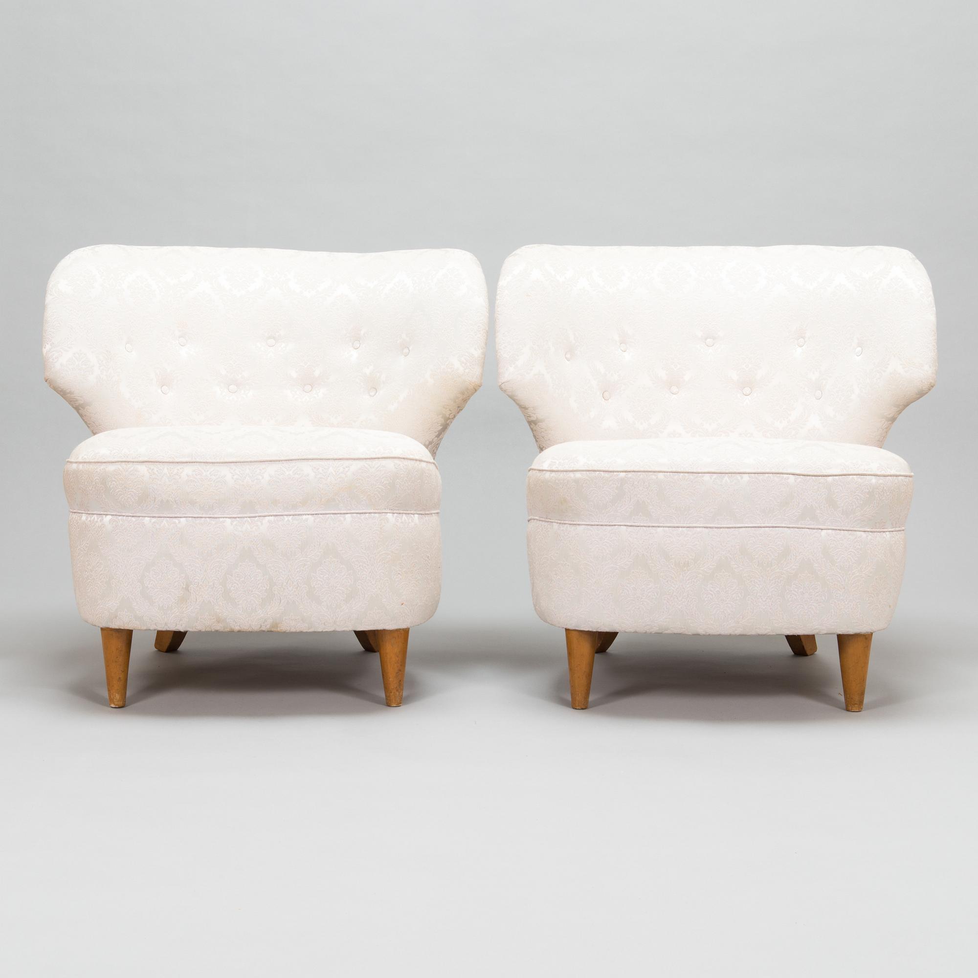 A pair of 1950's armchairs.