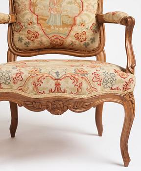 A matched pair of French Louis XV armchairs, mid 18th century.