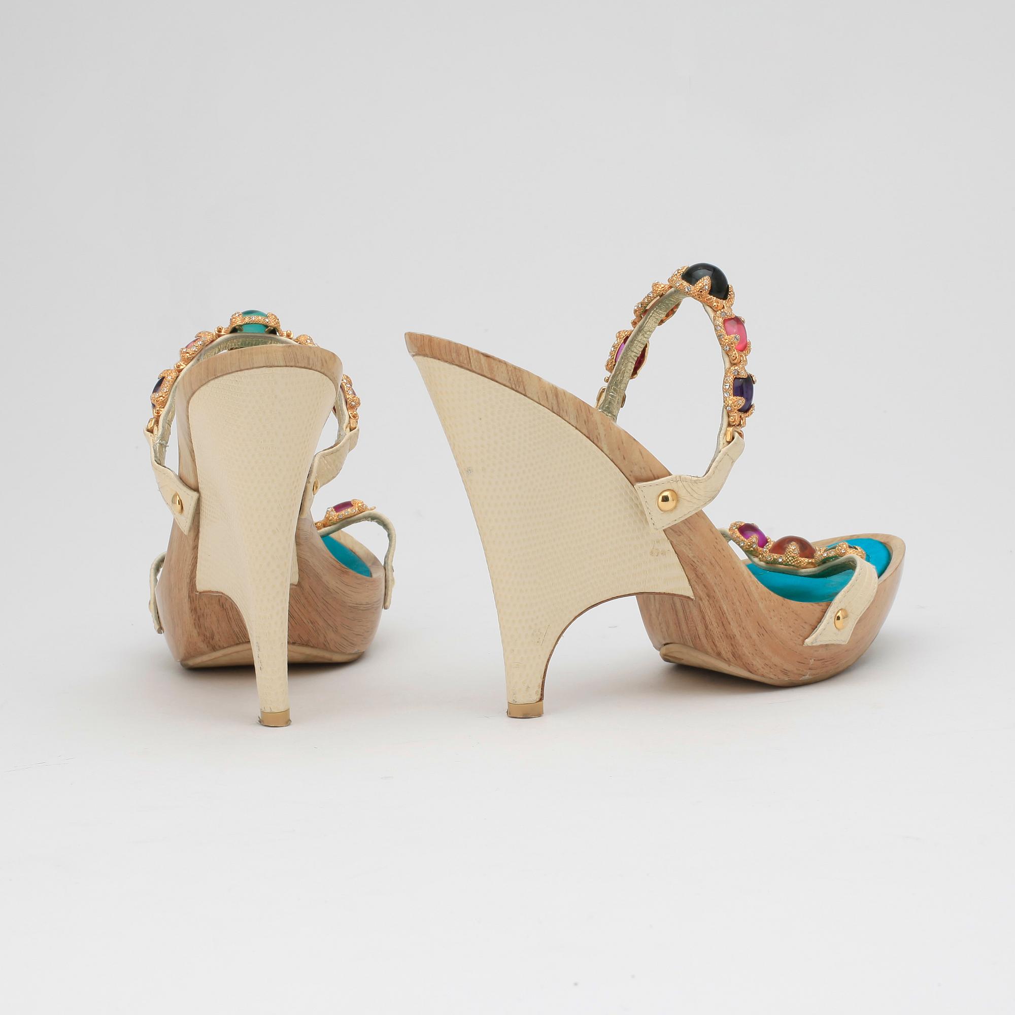 GIUSEPPE ZANOTTI, a pair of wedge heeled sandalettes with paste.