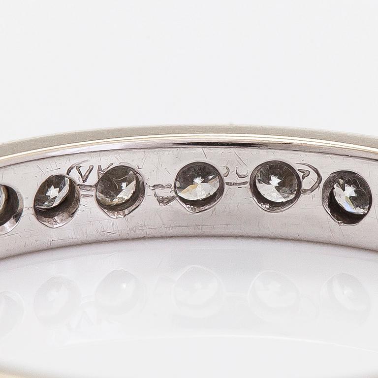 An 18K white gold eternity ring with brilliant-cut diamonds totalling approximately 0.60 ct.