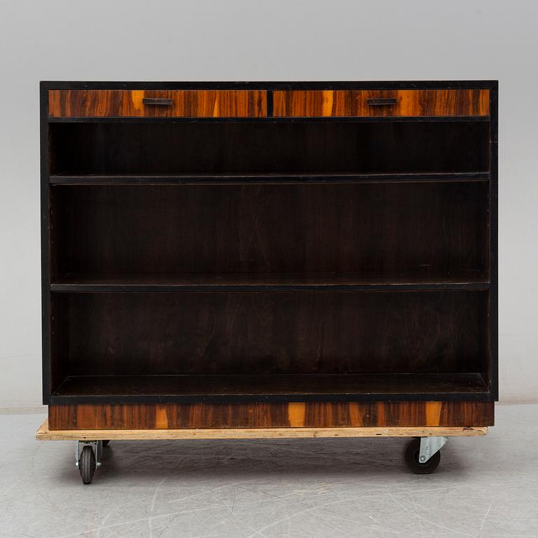 a 1930's stained birch bookshelf.