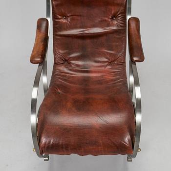 A 20th century steel frame rocking chair.