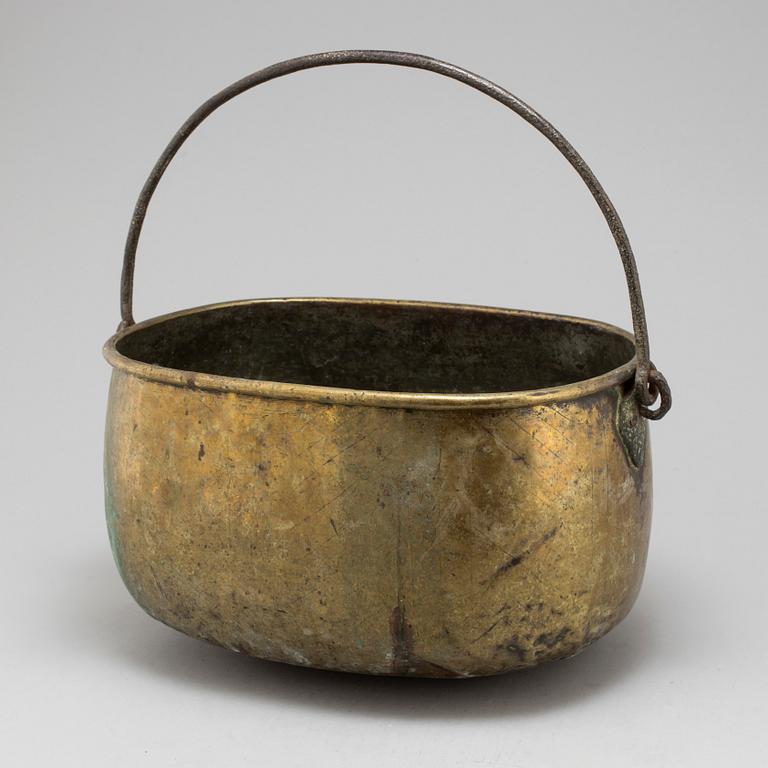 An 18th century brass cauldron.