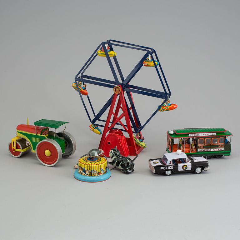 A lot of eight tinplate toys late 20th century.