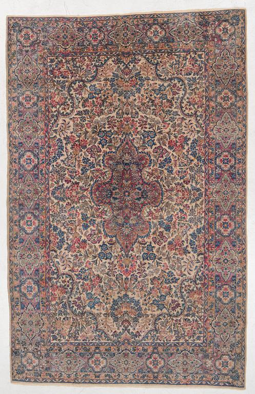 A semi-antique Kerman carpet, c. 273 x 172 cm.