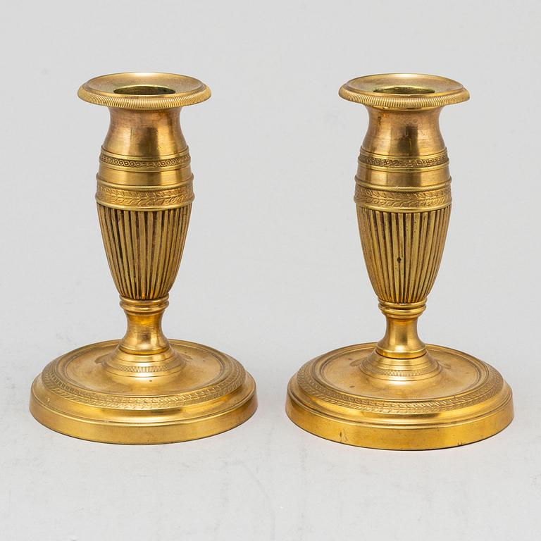 A pair of brass 19th century candlesticks.