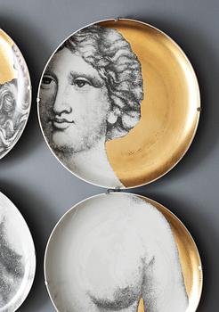 A set of twelve Piero Fornasetti 'Eva' porcelain plates, Milan, Italy.