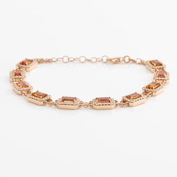 Bracelet 18K gold with orange sapphires and round brilliant-cut diamonds.