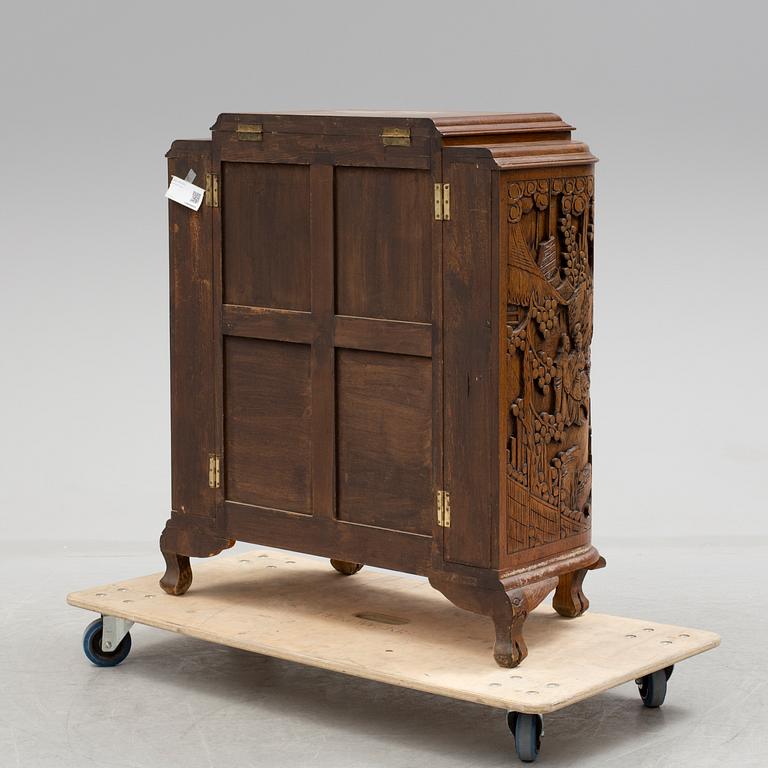 a chinese style bar cabinet from the late 20th century.