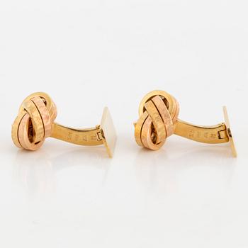 A pair of 18K two colour gold cufflinks.