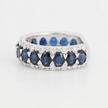 Oval sapphire and brilliant-cut diamond ring.