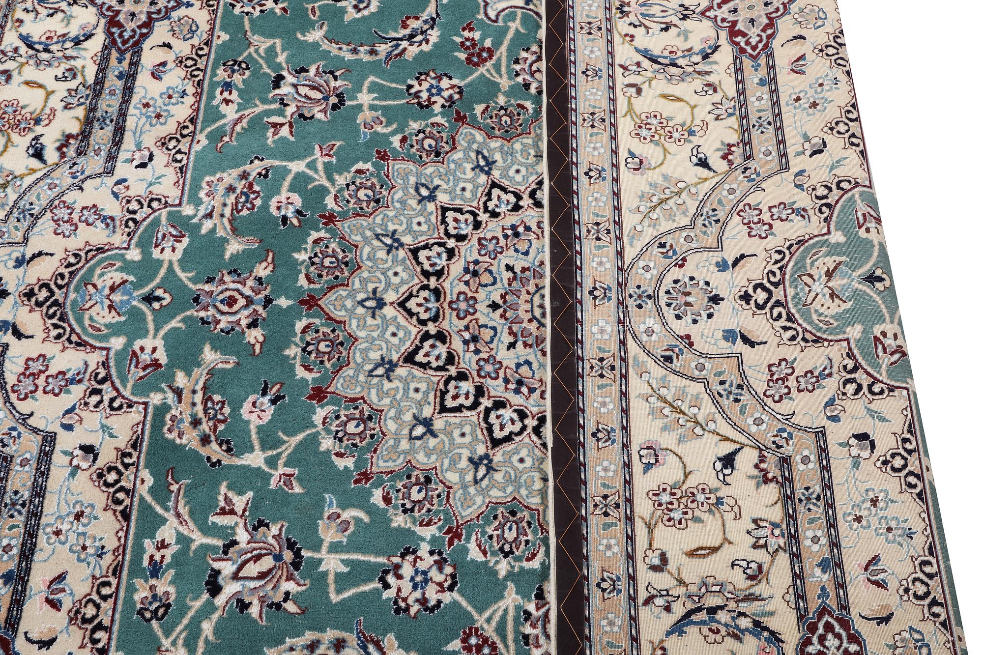 A Nain carpet, part silk, 6 laa, ca. 300 x 201 cm.