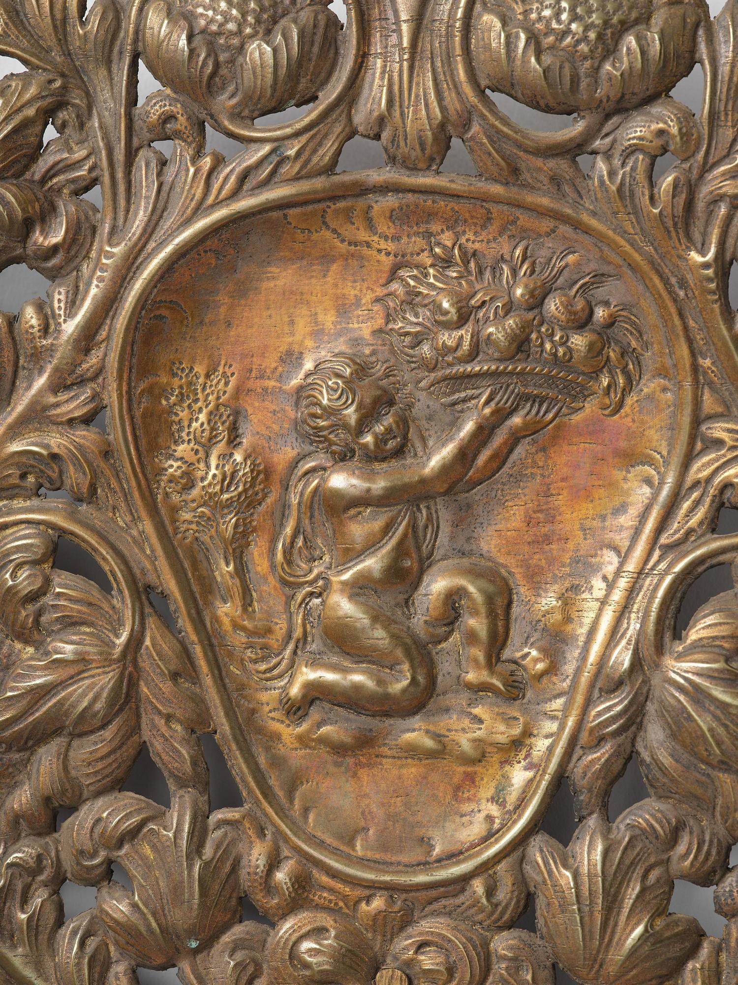 A set of four Swedish Baroque repoussé silvered brass reflector one-branch reflector plates, ca 1690-1700.