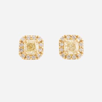 Light yellow diamond earrings.