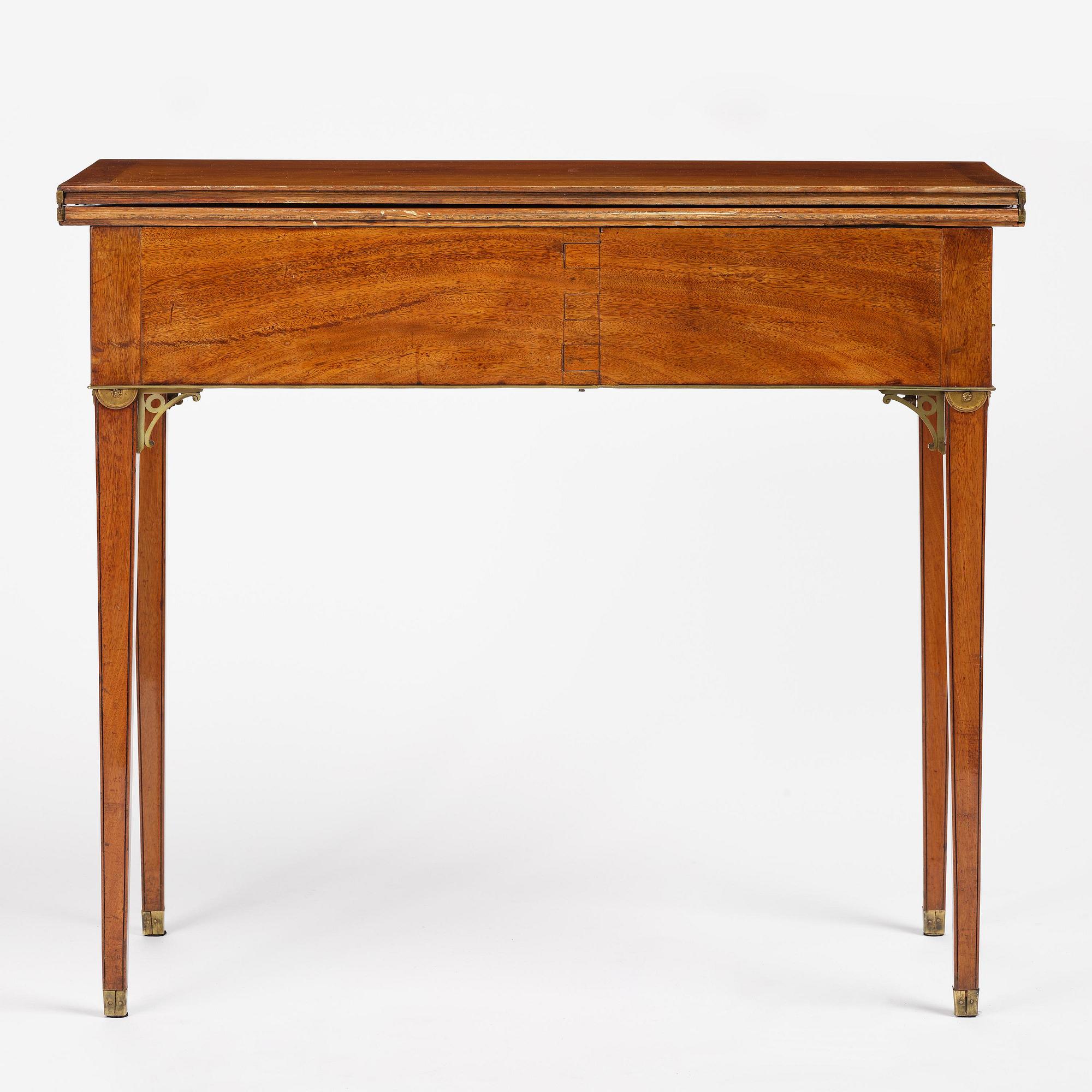 A late Gustavian mahogany games table, presumably by A. Nordström (Journeyman at G. Iwersson 1806-09).