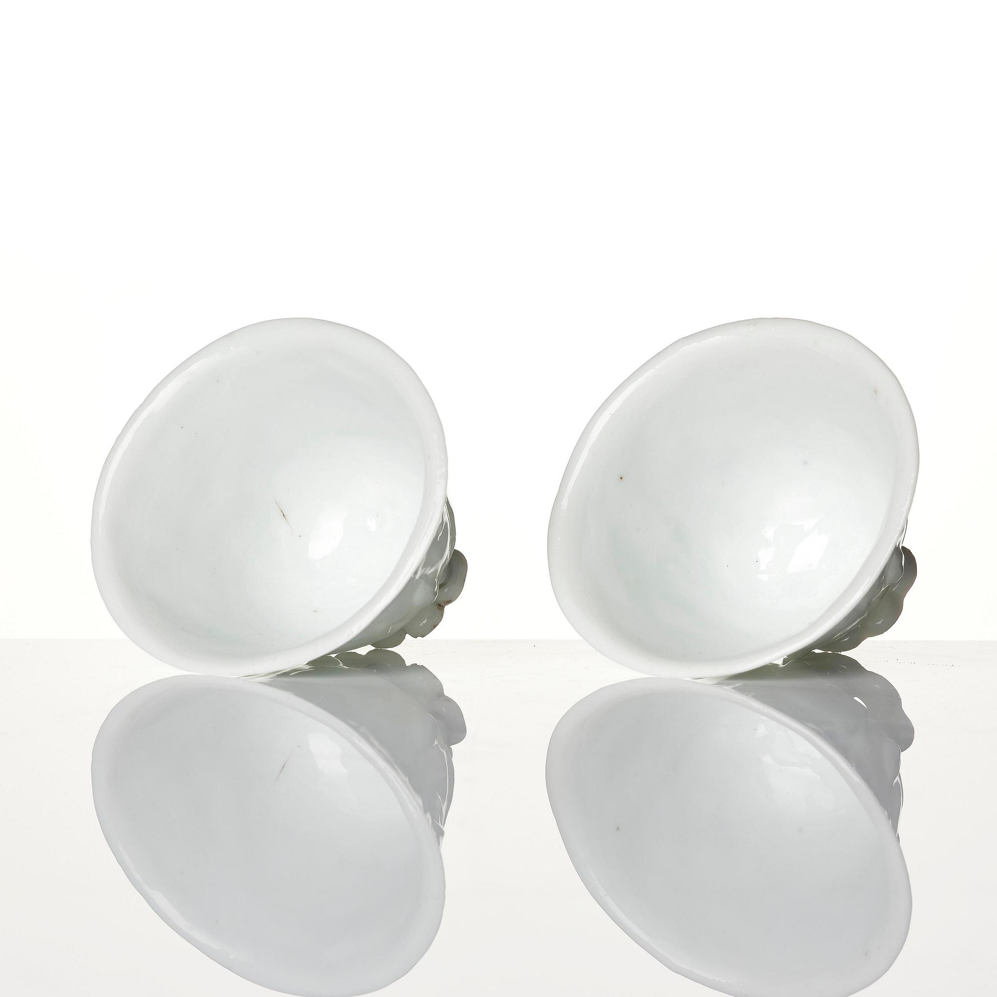 A pair of blanc de chine libation cups, Qing dynasty, 19th century.