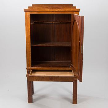 An Art Déco mahogany cabinet.