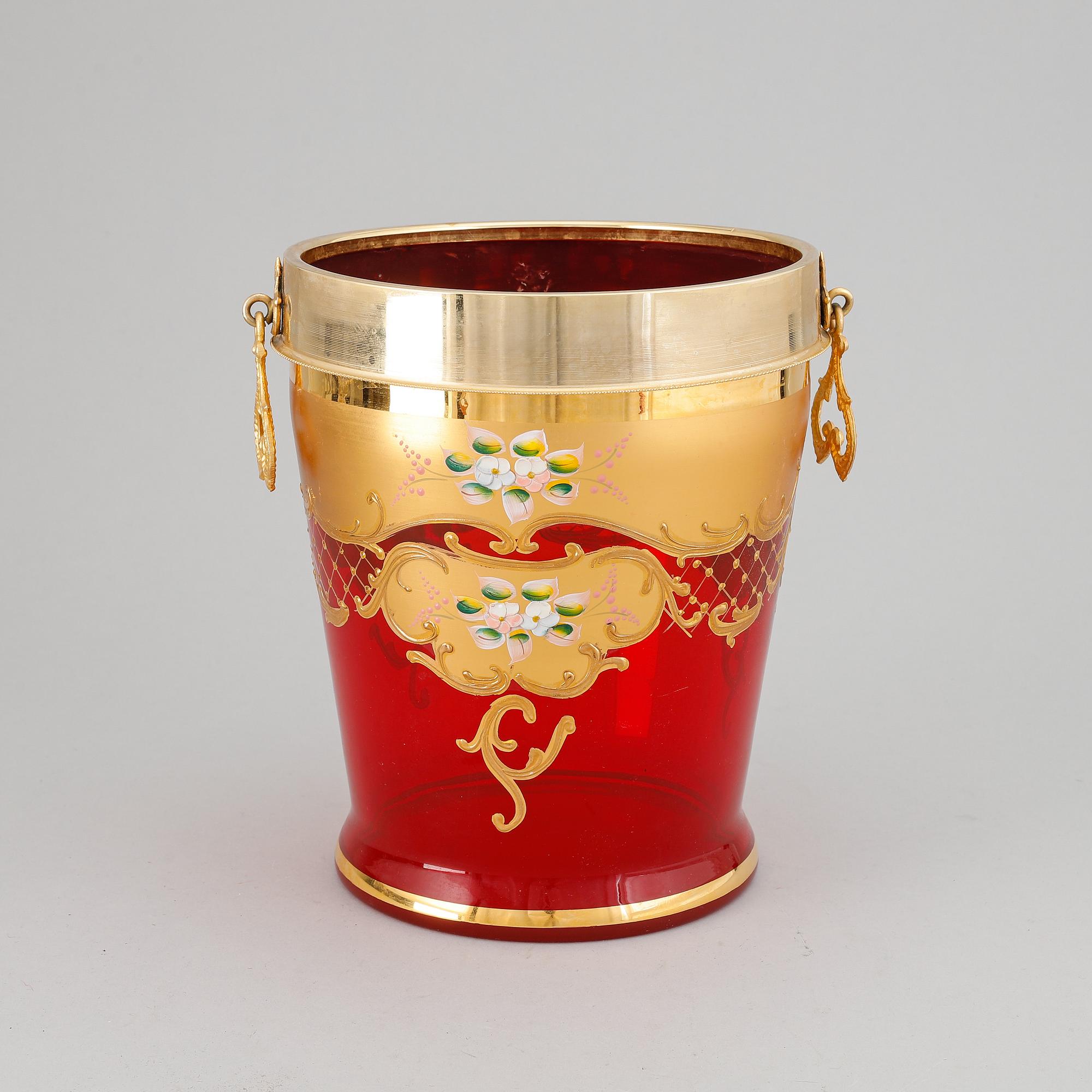 A red glass wine cooler.