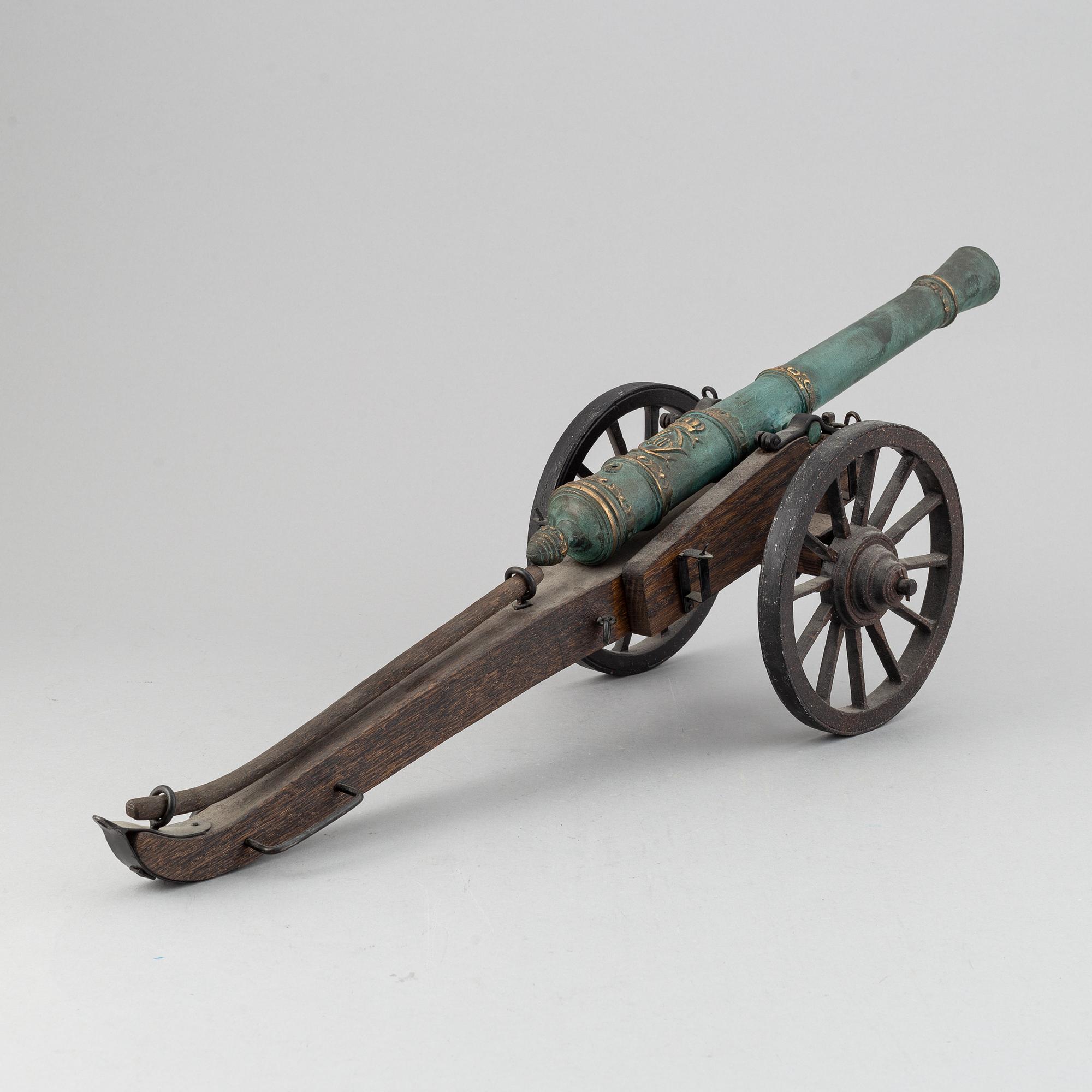 A copy of a field canon with monogram of king  Karl XII produced by Svensk Metallkonst, Carlscrona in late 20th century.