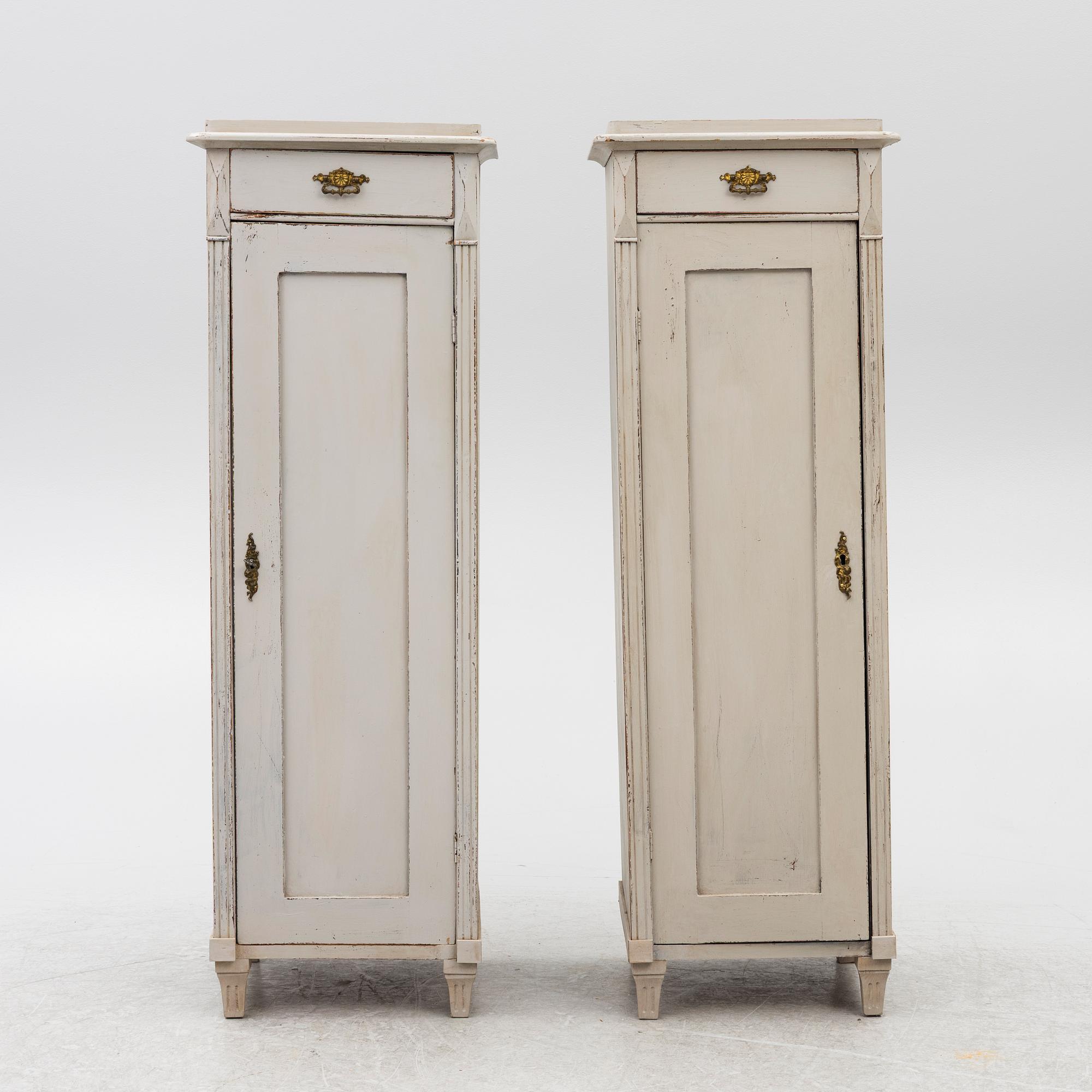 A pair of column cabinets, circa 1900.