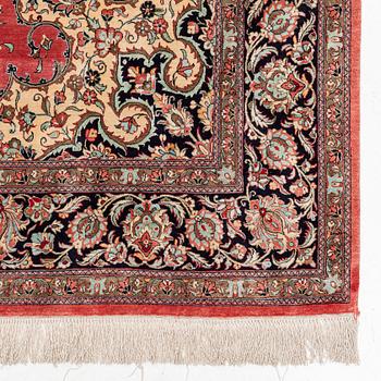 A 1960's silk Qum carpet, c. 312 x 201 cm.