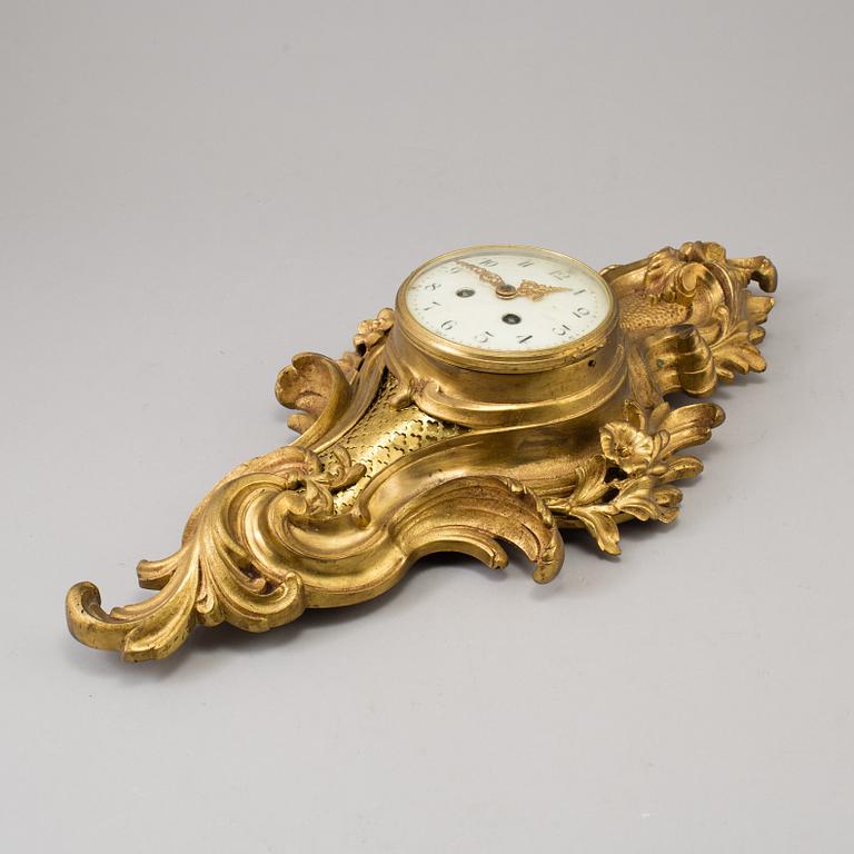 A  rococo-style wall clock around 1900.