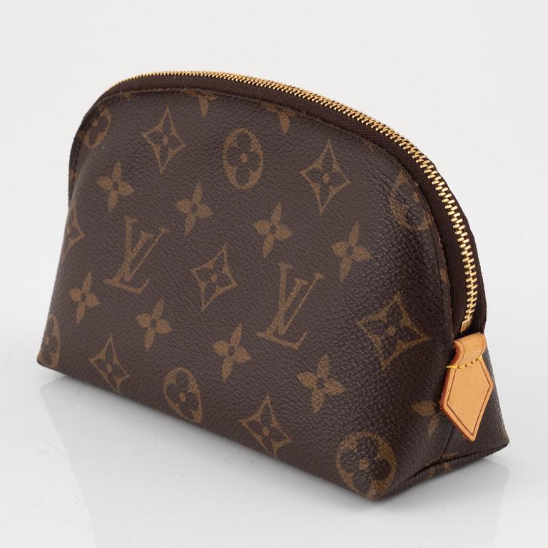 Louis Vuitton, makeup bag and wallet.