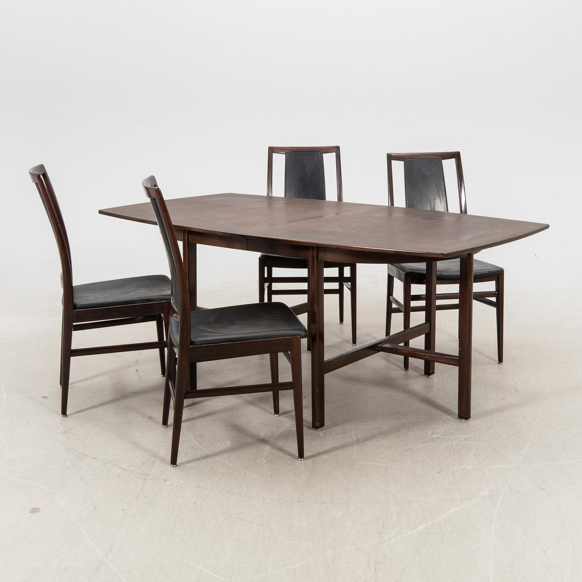 A table and four chairs in lacquered mahogany by David Rosén, "Triva-diné", middle of the 20th century.