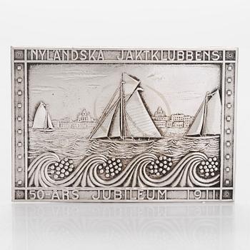 A silver plated jubilee plaque for NJK Nyländska Jaktklubben's 50th anniversary 1911.