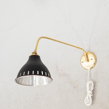 A bras wall lamp later part of the 20th century.