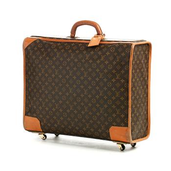 LOUIS VUITTON, a monogram canvas suitcase on wheels.