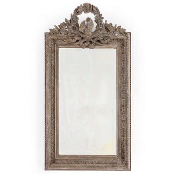 A carved wooden framed mirror, circa 1900.